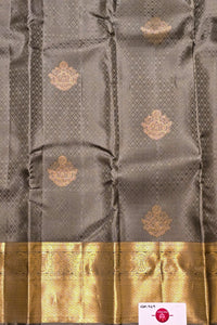 Gray fabric with gold patterns and border