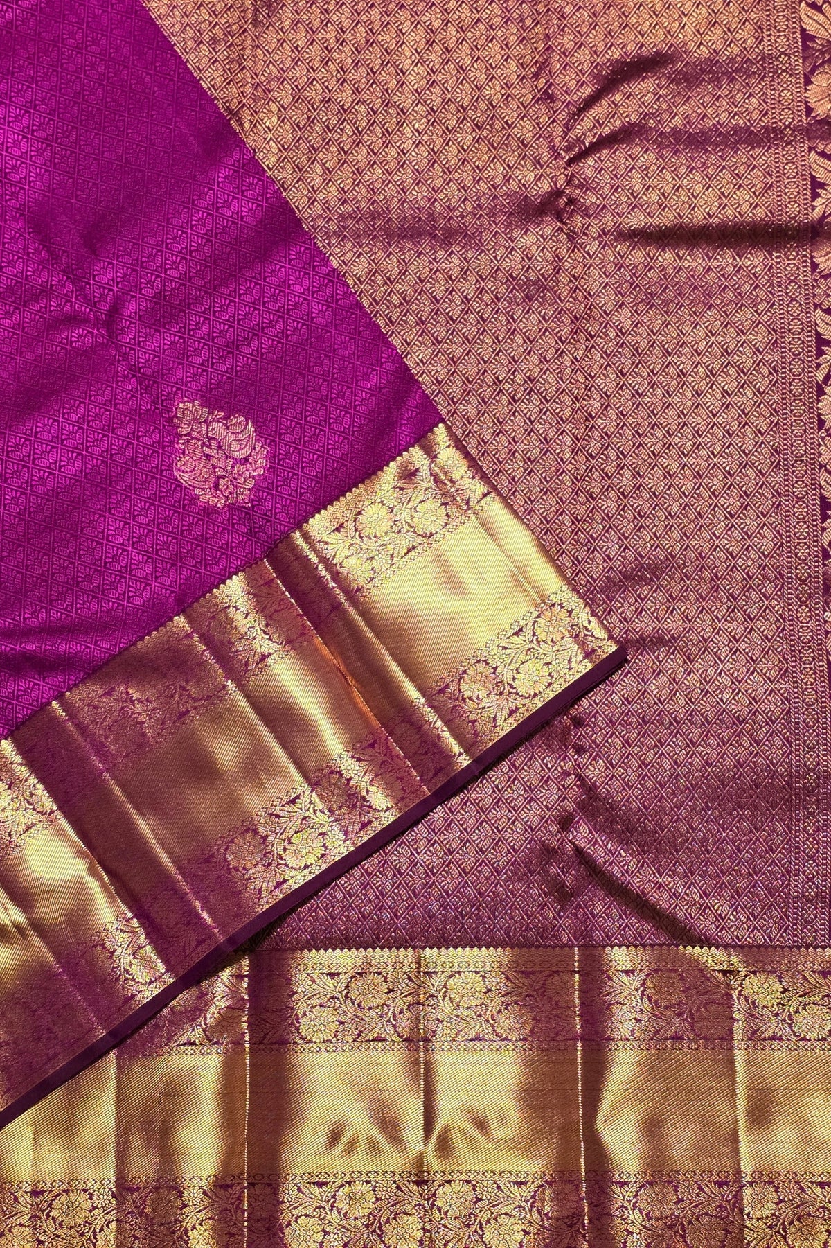 Purple and gold saree with intricate patterns