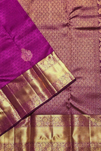 Purple and gold saree with intricate patterns