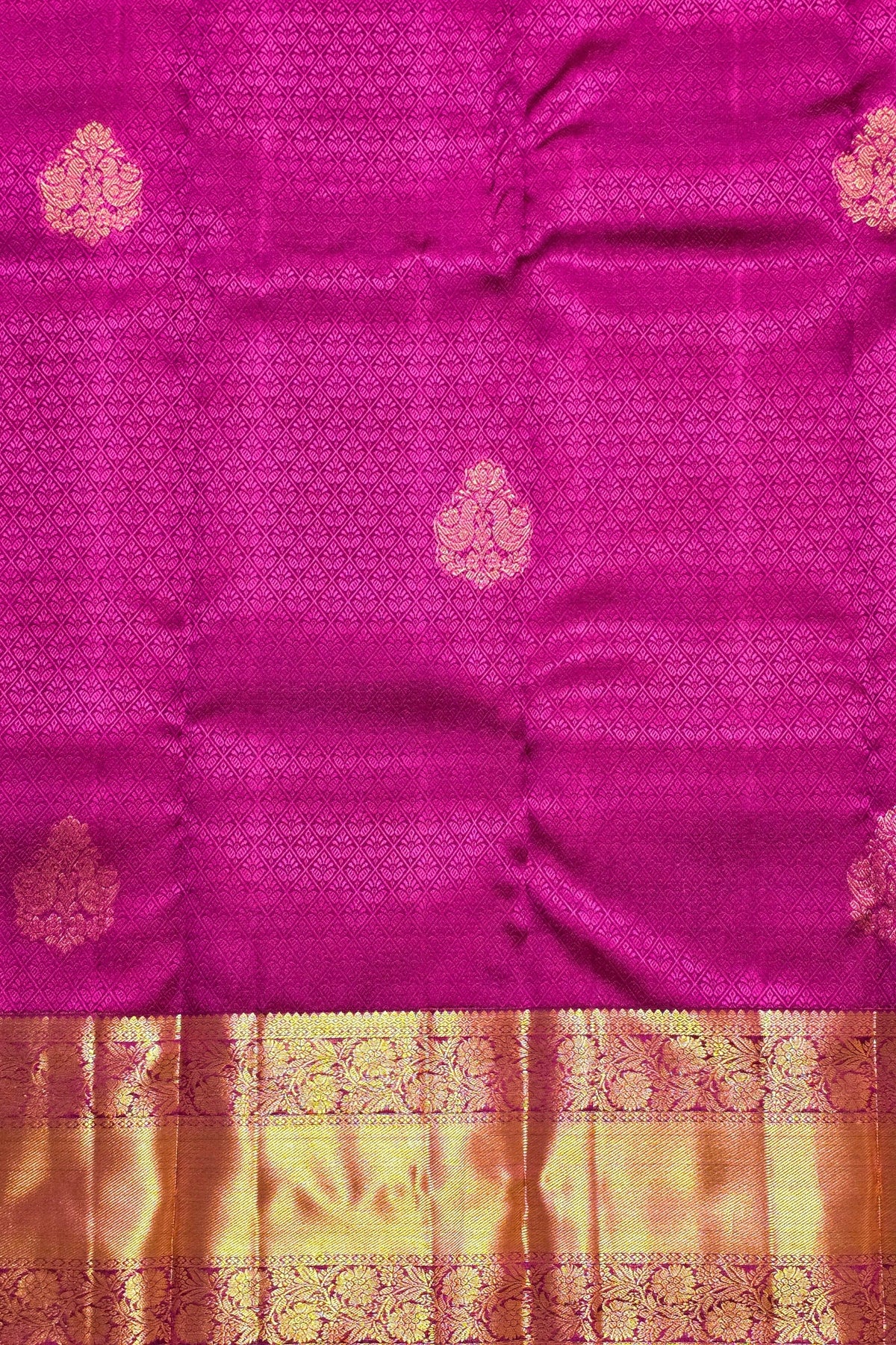 Pink saree with gold patterns