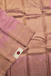 Pink saree with a woven pattern and a visible brand label.