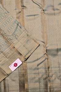 Close-up of a fabric with a patterned tag on a textured background