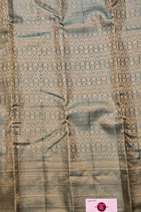 Textured fabric with a subtle pattern on a plain background