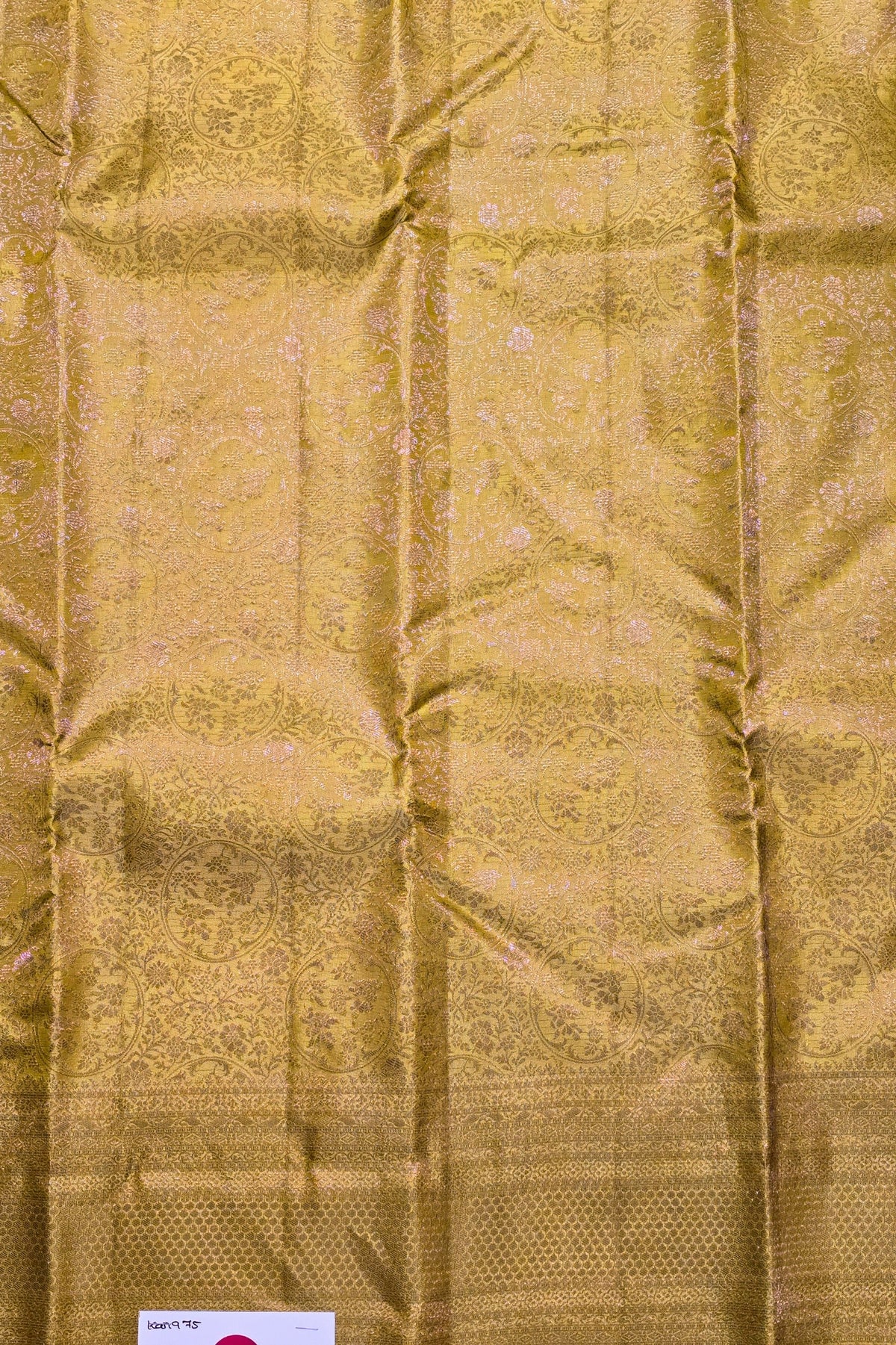 Gold fabric with intricate patterns and textures