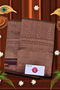 Brown saree with intricate patterns on a wooden background