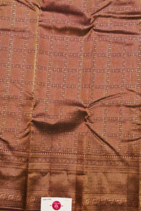 Brown fabric with intricate pattern and visible tag