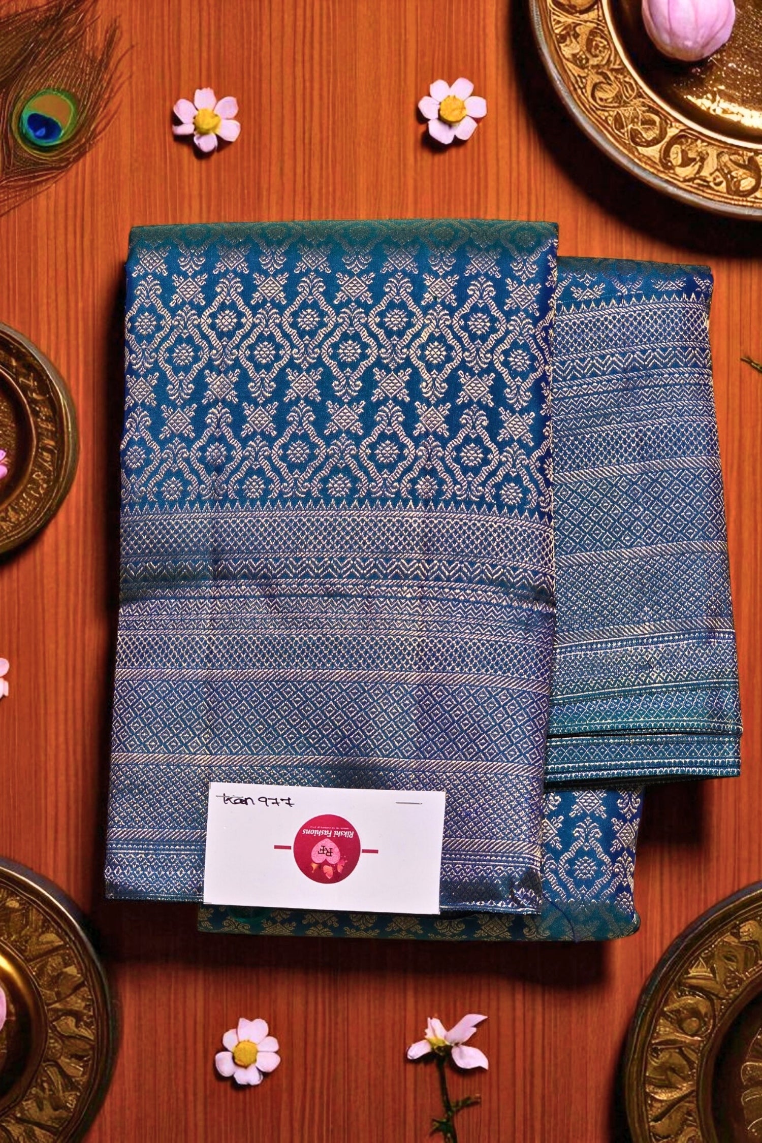 Blue patterned fabric with a brand label on a wooden surface