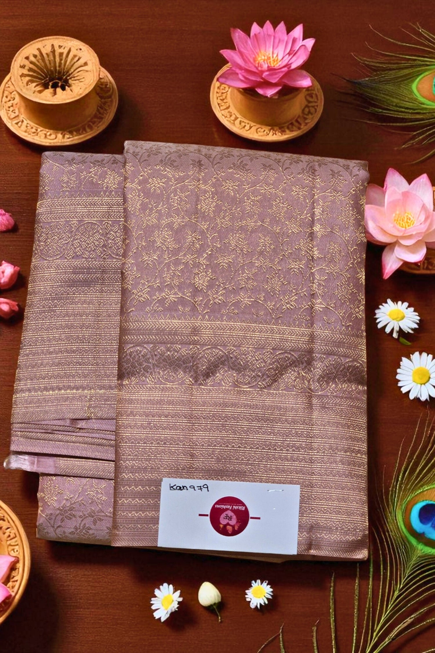Stack of brown fabric with a brand label on a wooden surface with decorative elements.