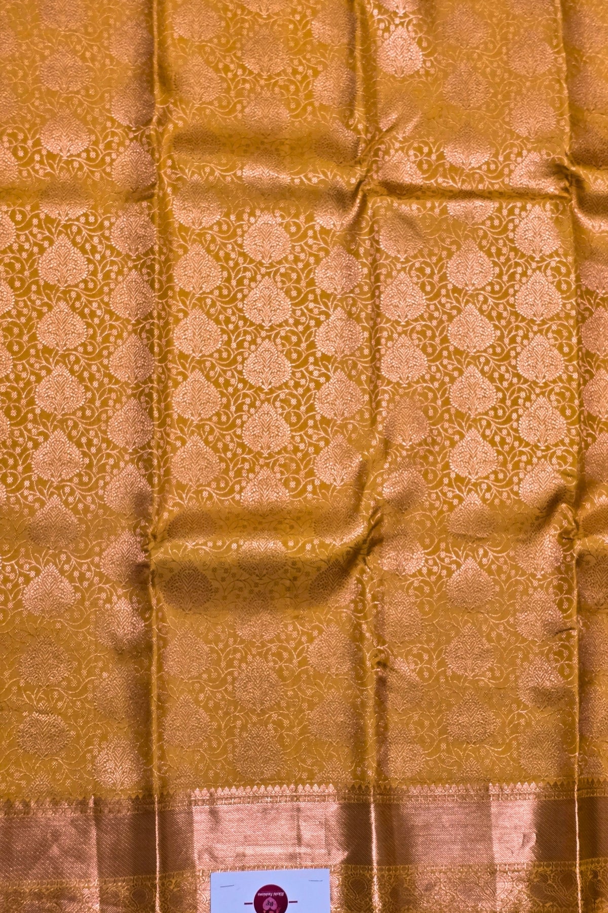 Gold fabric with intricate pattern