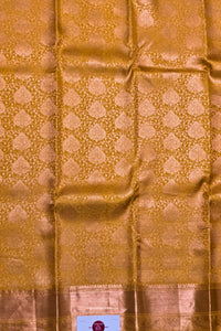 Gold fabric with intricate pattern