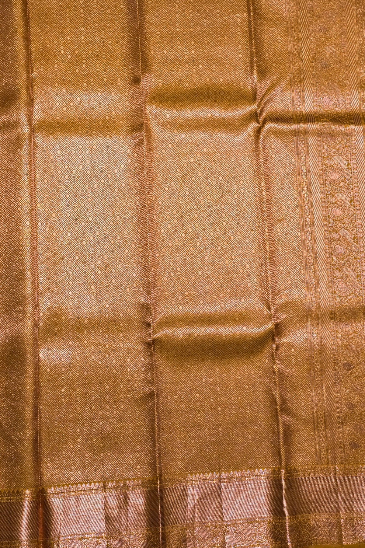 Close-up of brown fabric with a subtle pattern