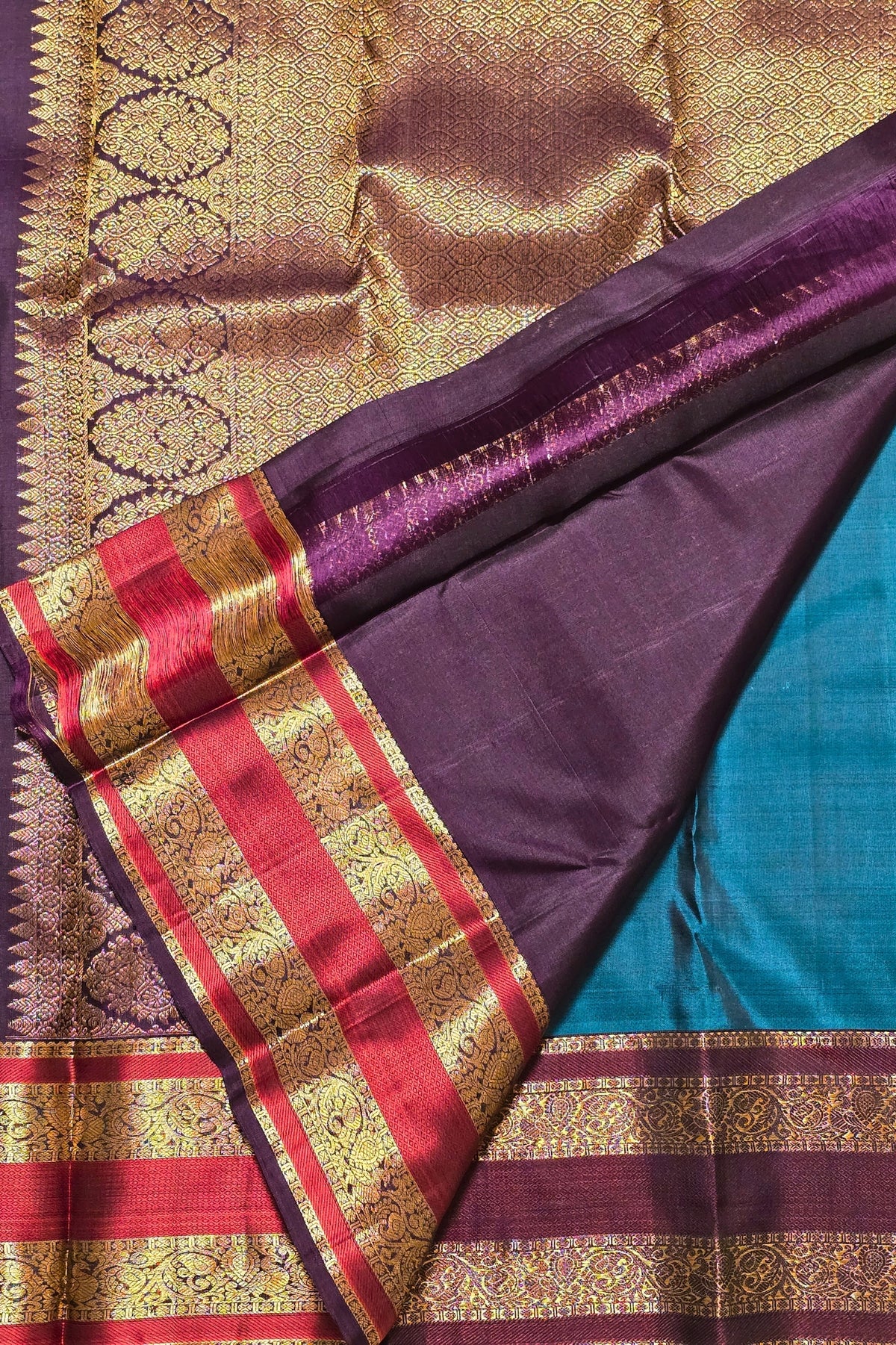 Colorful traditional fabric with intricate patterns and borders