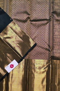 Gold fabric with intricate patterns and a visible brand label.