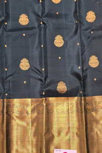 Dark blue fabric with gold embroidery and border