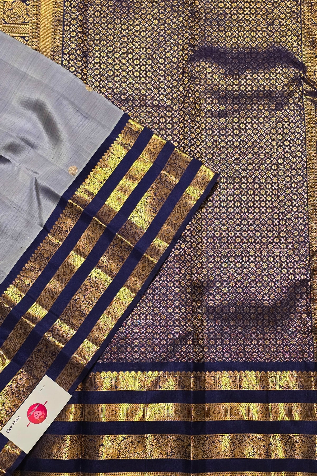 Traditional saree with gold and blue patterns on a textured background
