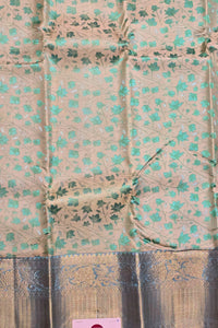 Close-up of a fabric with green floral pattern on a beige background