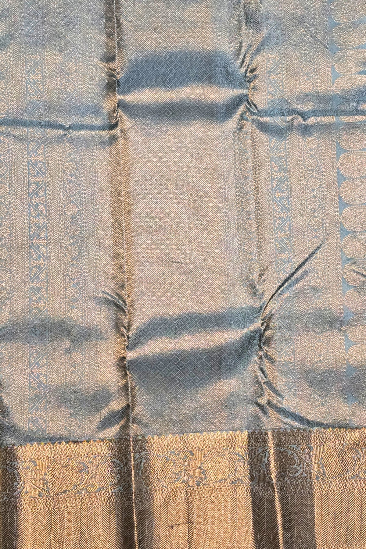 Close-up of a patterned fabric with blue and brown tones