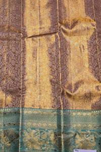 Textile with gold and brown patterns on a blue background