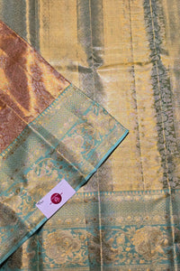 Textile with a floral pattern and a visible brand label on a textured surface.