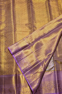 Close-up of a fabric with gold and purple pattern