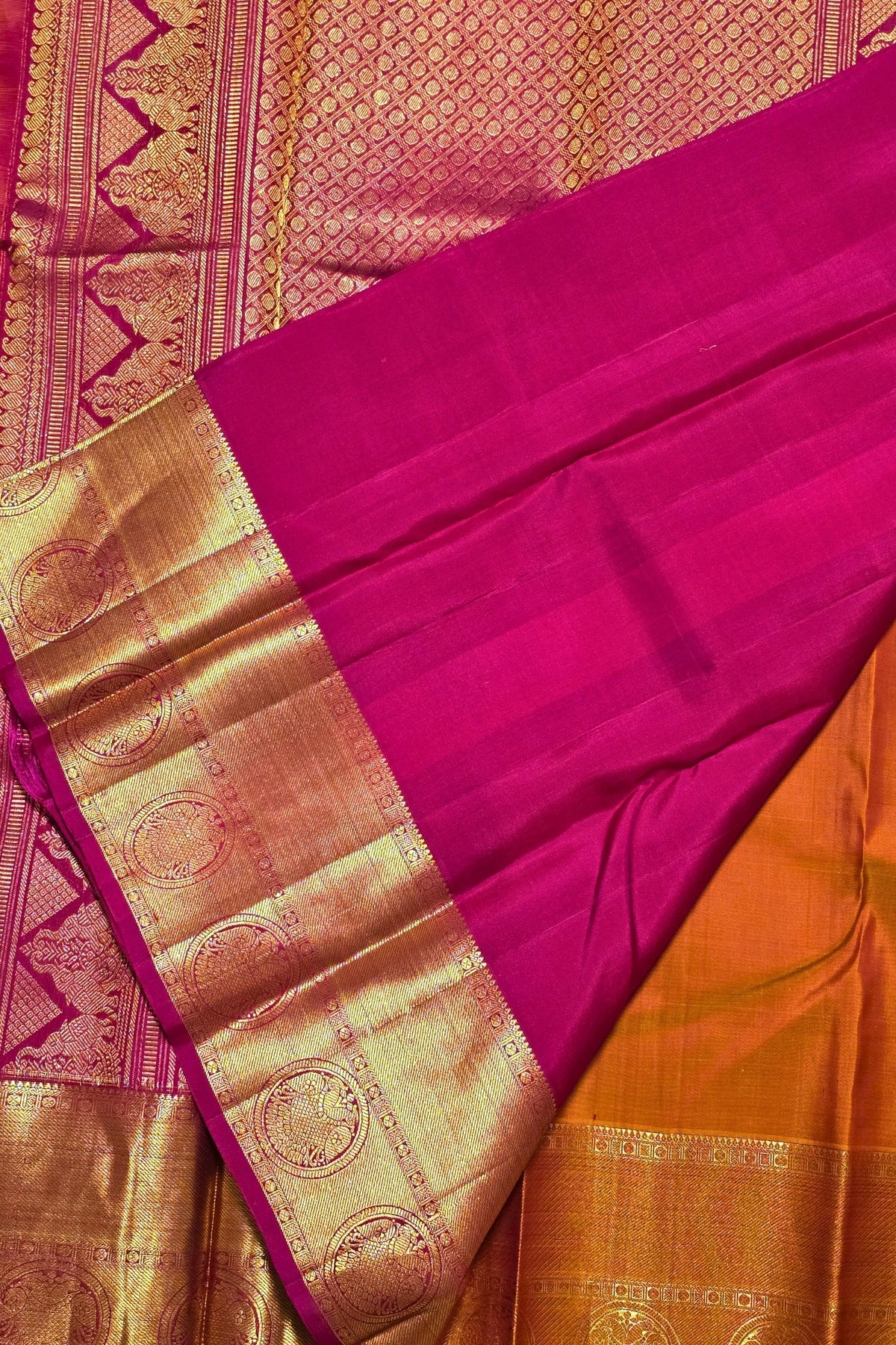 Saree with pink and gold border on a pink background