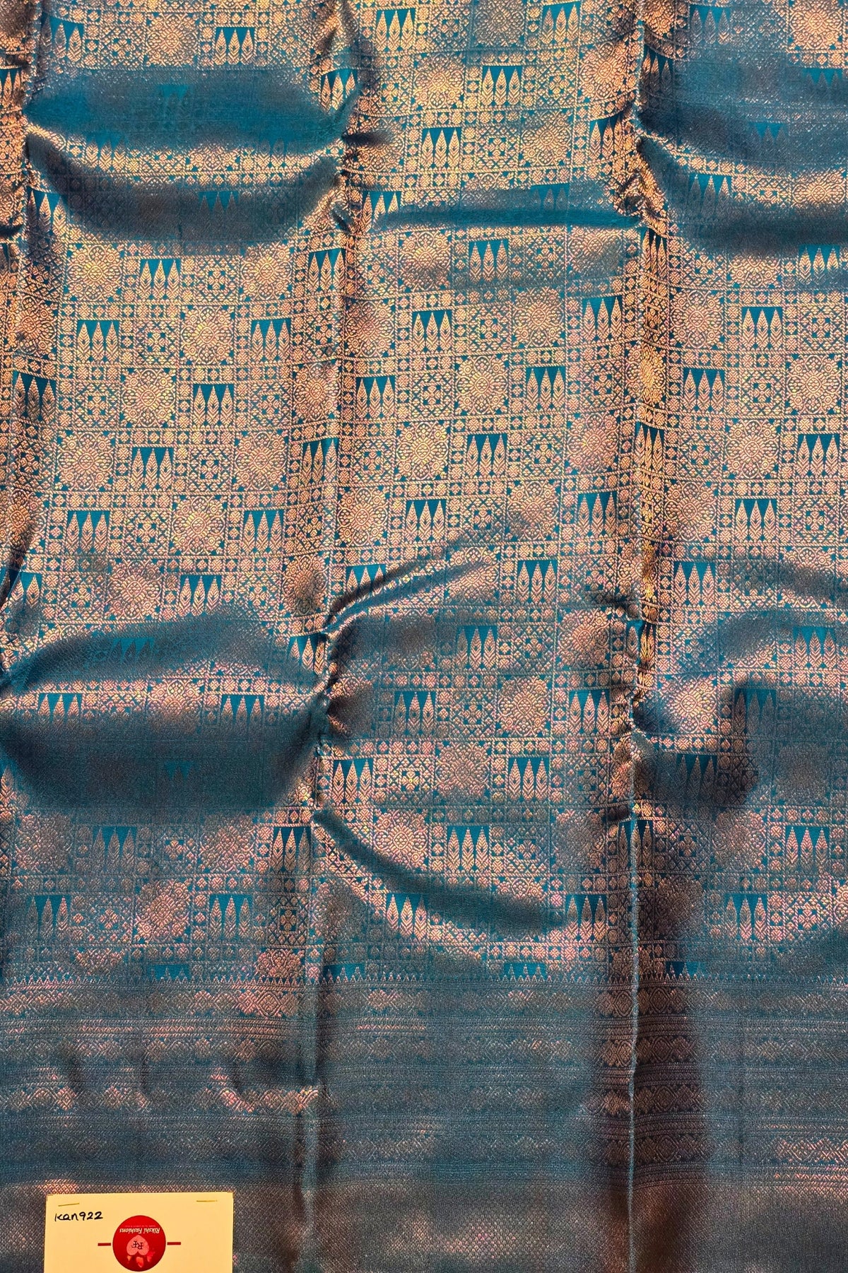 Textured fabric with a blue and gold pattern
