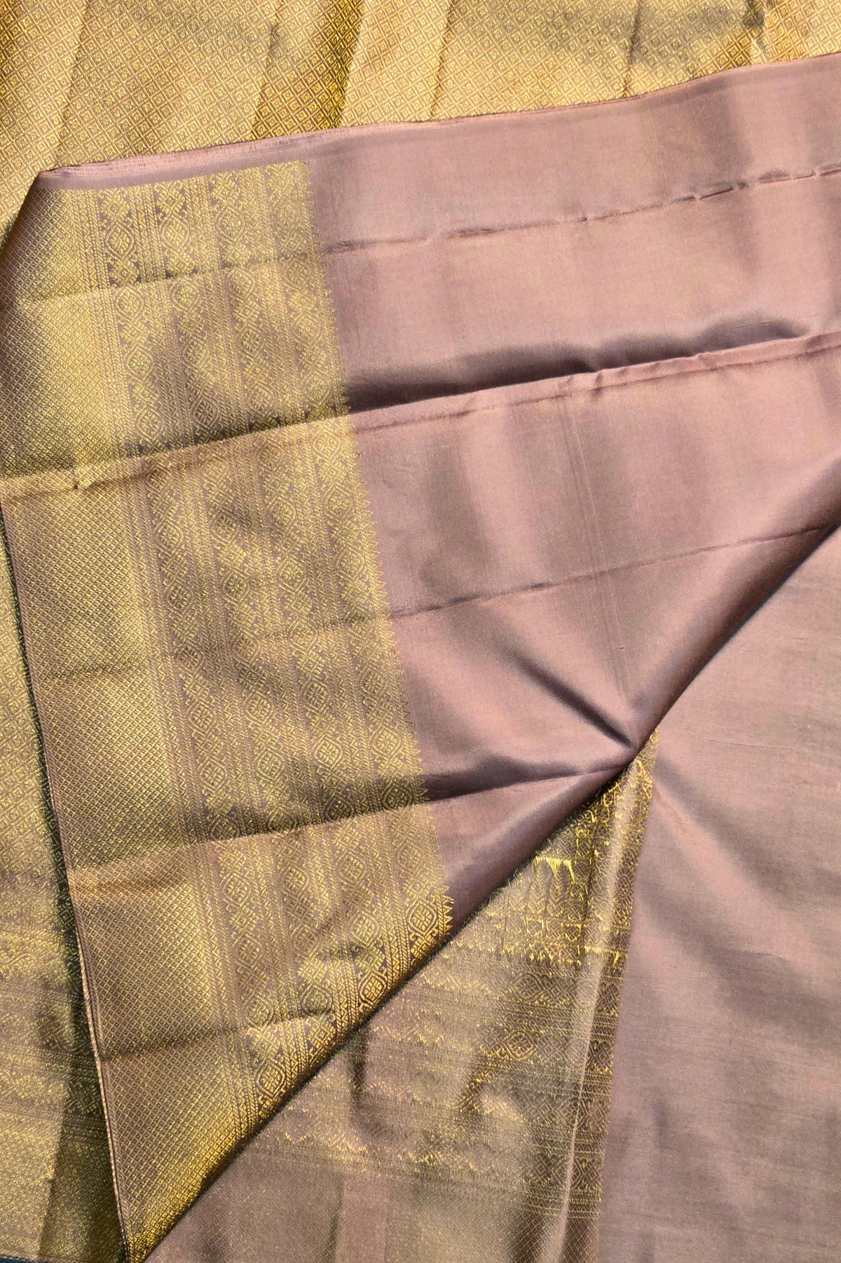 Close-up of a fabric with a checkered pattern in green and purple.