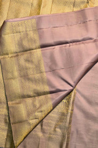 Close-up of a fabric with a checkered pattern in green and purple.