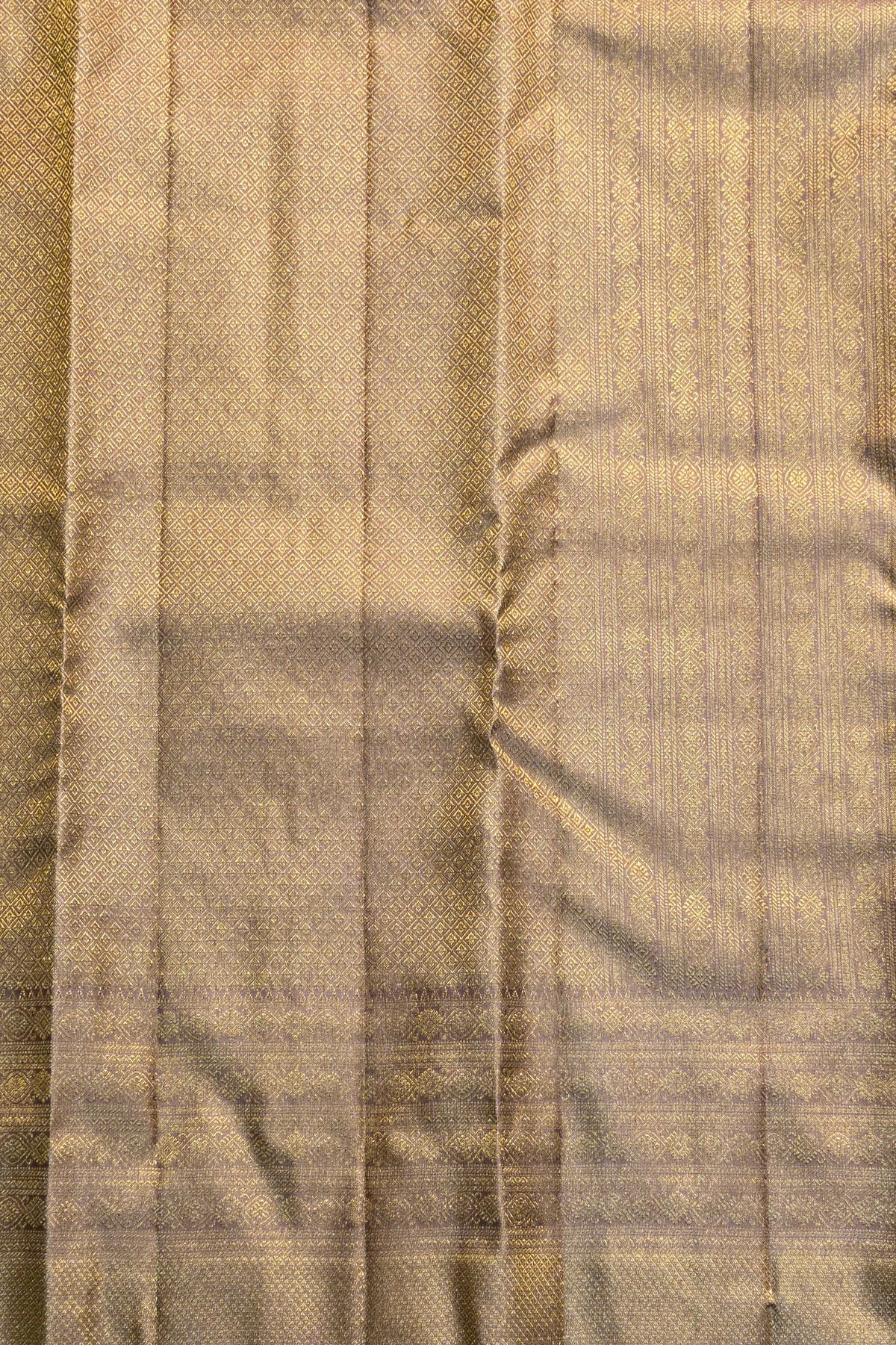 Close-up of a fabric with a checkered pattern in shades of brown and beige.