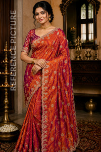 Woman wearing a traditional orange and purple saree in an ornate room.
