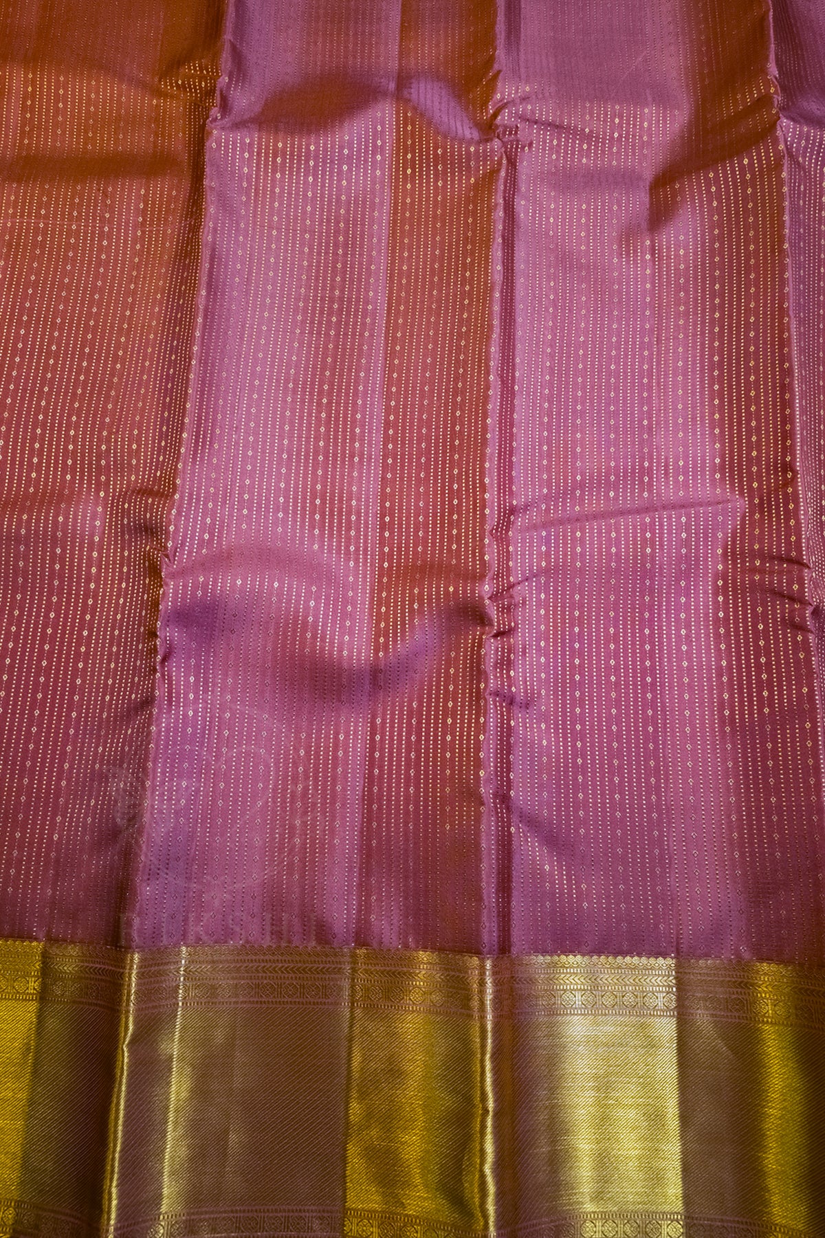 Royal Purple Silk Saree with Wide Gold Zari Border, showcasing elegant fabric texture and gold zari border.